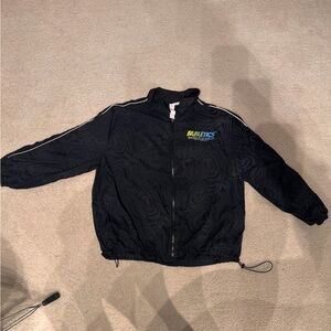 Fabletics Black Reflective Windbreaker Jacket with Blue Accent Logo